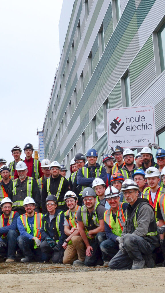 The large Houle team in 2010 crowded around outside one of their projects