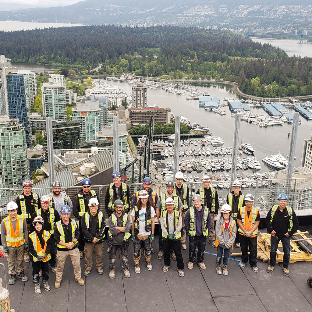 1133 Melville - The Stack Outdoor Team Photo on Top Floor of Building