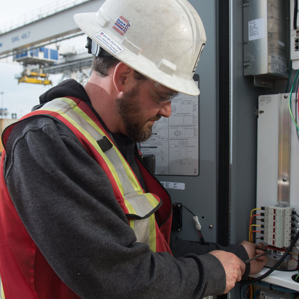 GCT Deltaport Terminal Road and Rail Improvement Project Electrician Working on Controls Panel