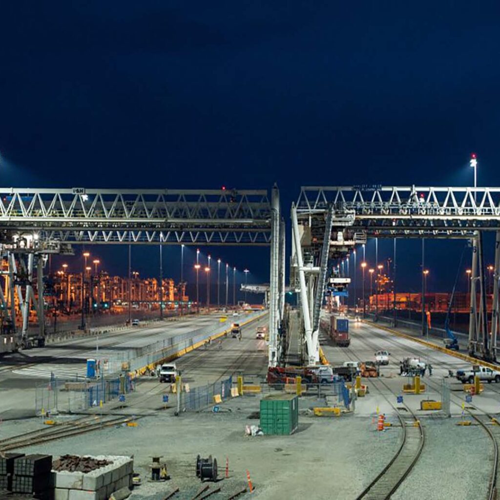 Deltaport Terminal Facility at Night with Cranes and Rail System