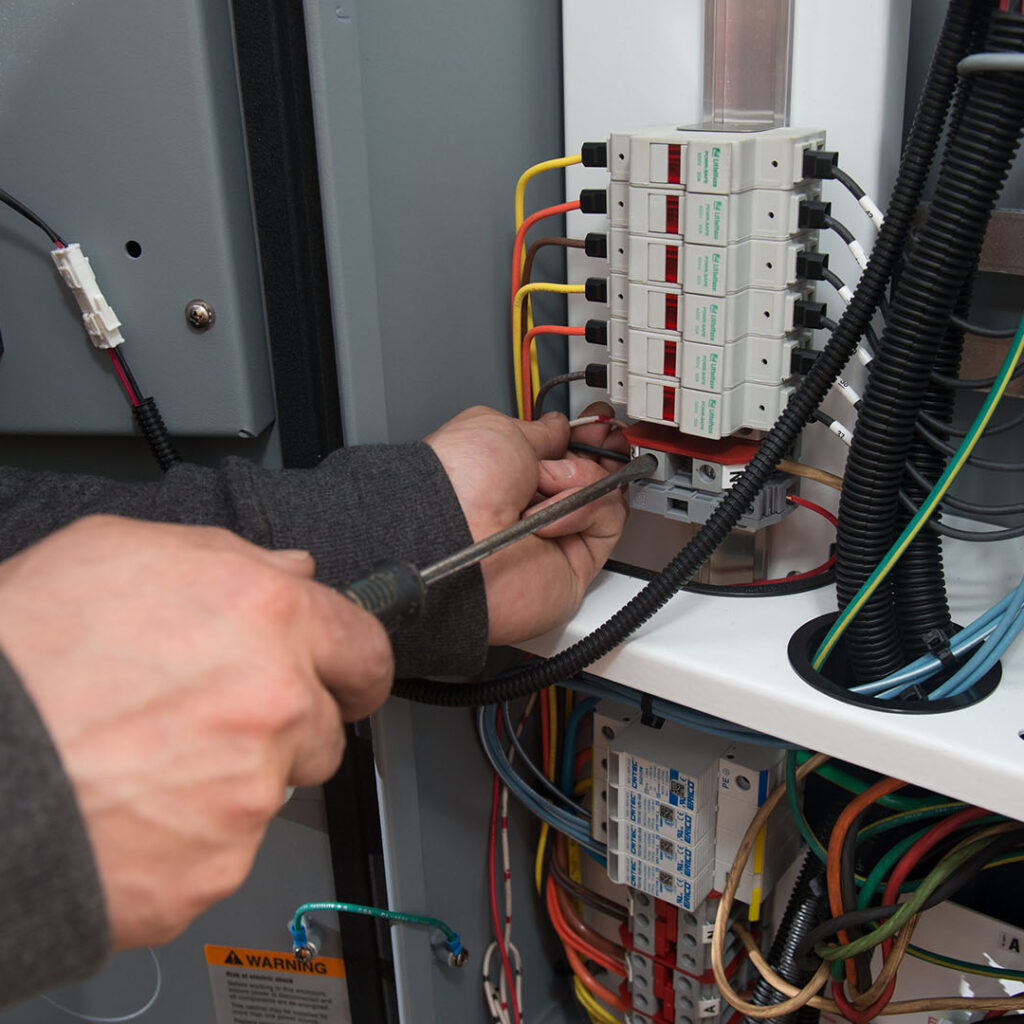 GCT Deltaport Terminal Road and Rail Improvement Project Electrician Working on Controls Panel