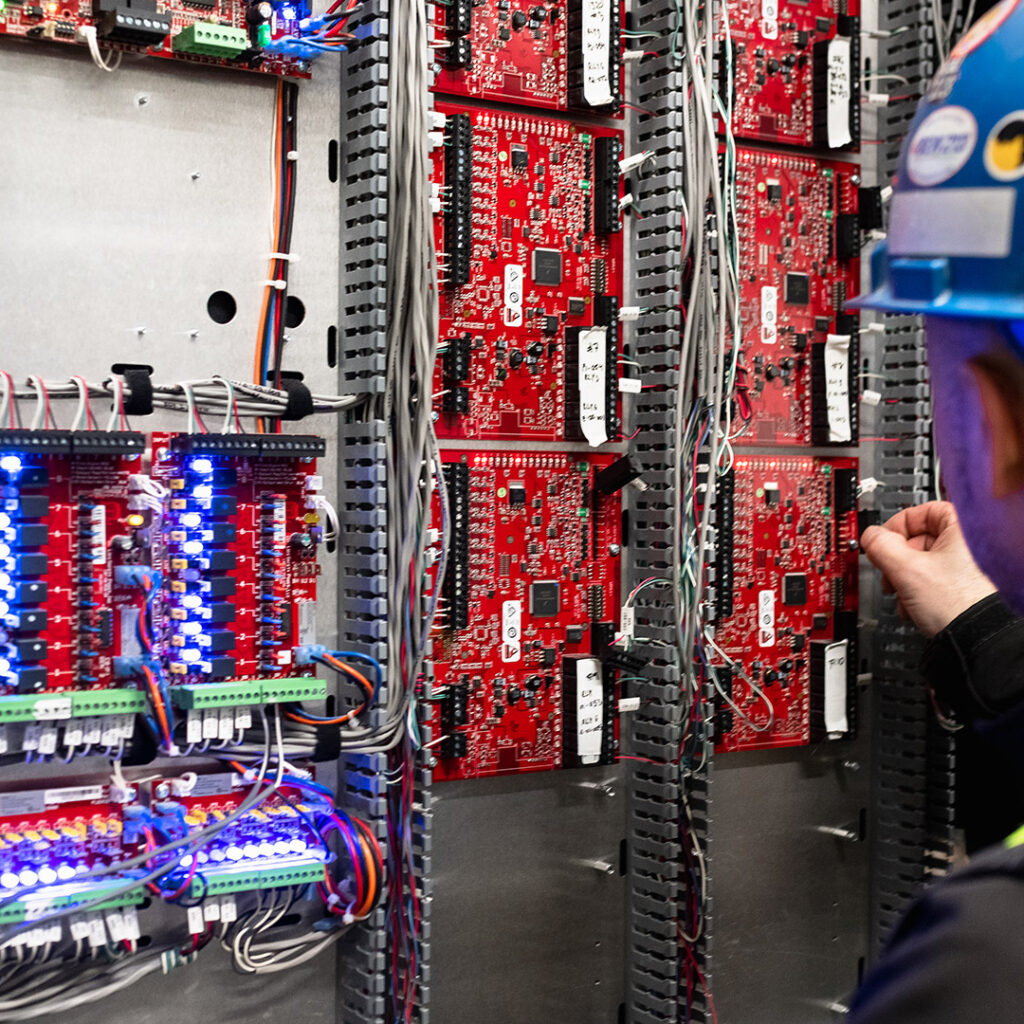 1133 Melville - The Stack Electrician Working on Security Panel
