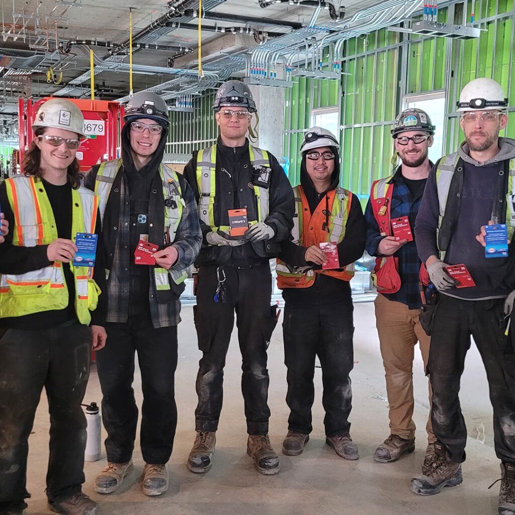 Lions Gate Hospital field staff holding gift cards