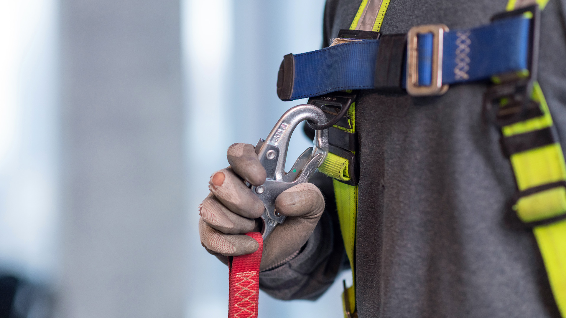 A Houle team member fastening their safety harness