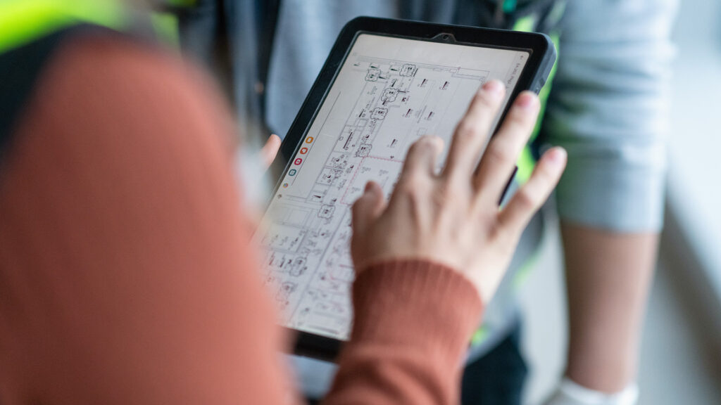 Close up view of a tablet device showing electrical drawing