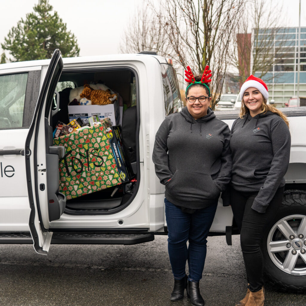 Houle staff dropping off toy donations for the Lower Mainland Christmas Bureau.