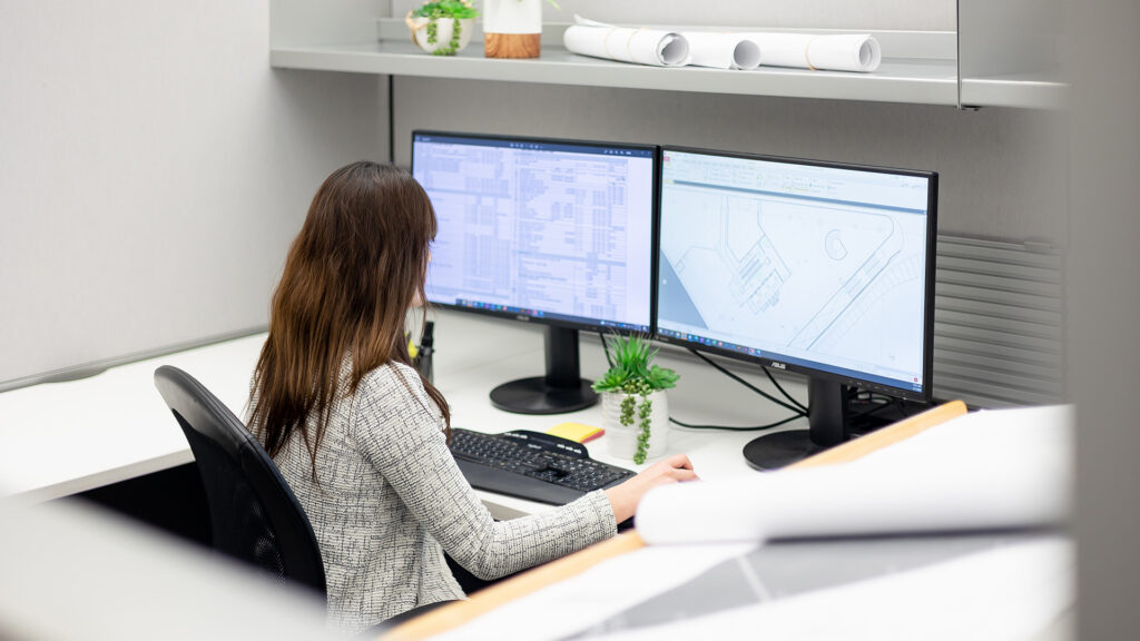 Houle employee working at a computer.