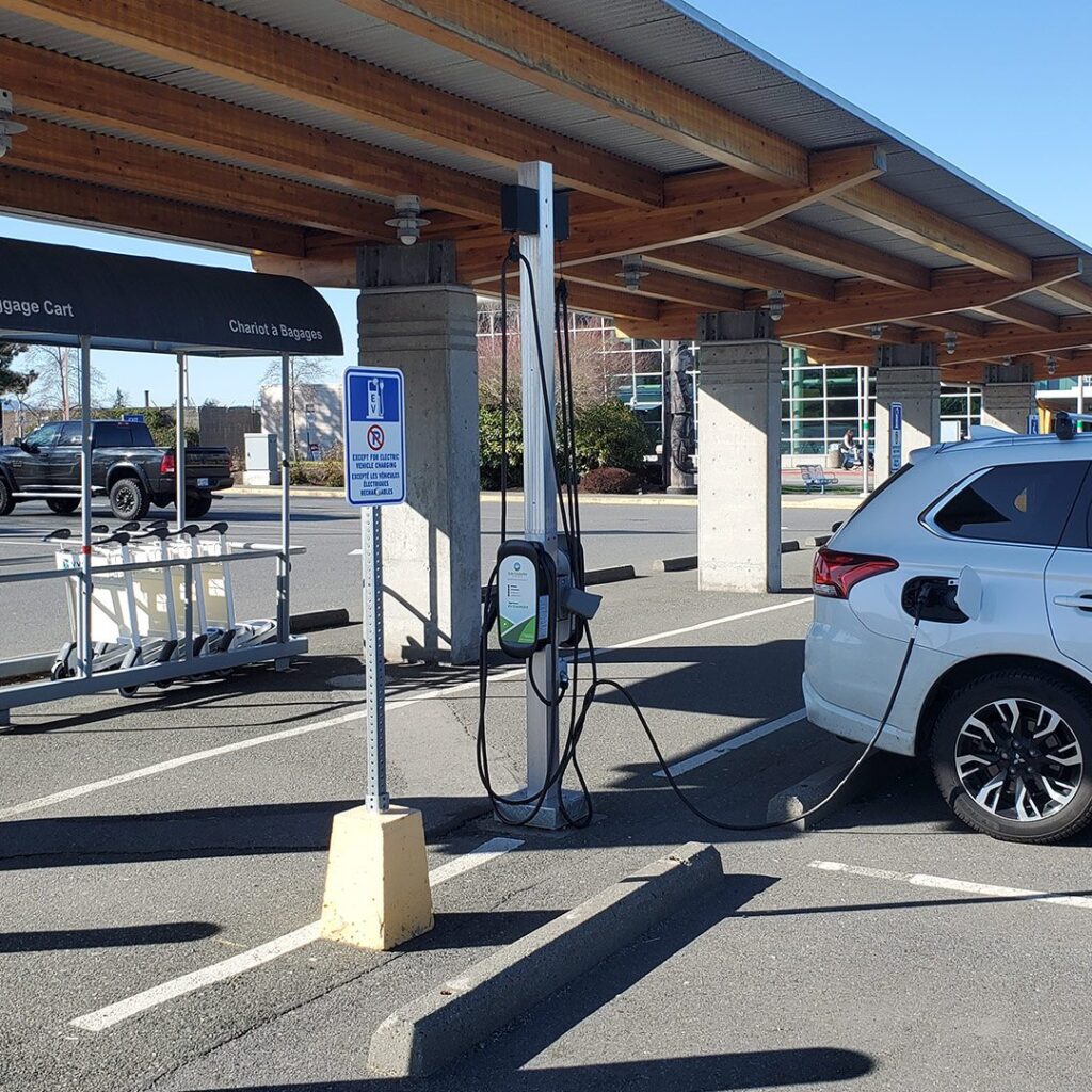 An Electric Vehicle charging at the Victoria International Airport with our Sun Country EV Charger
