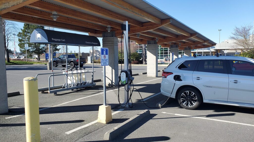 An Electric Vehicle charging at the Victoria International Airport with our Sun Country EV Charger