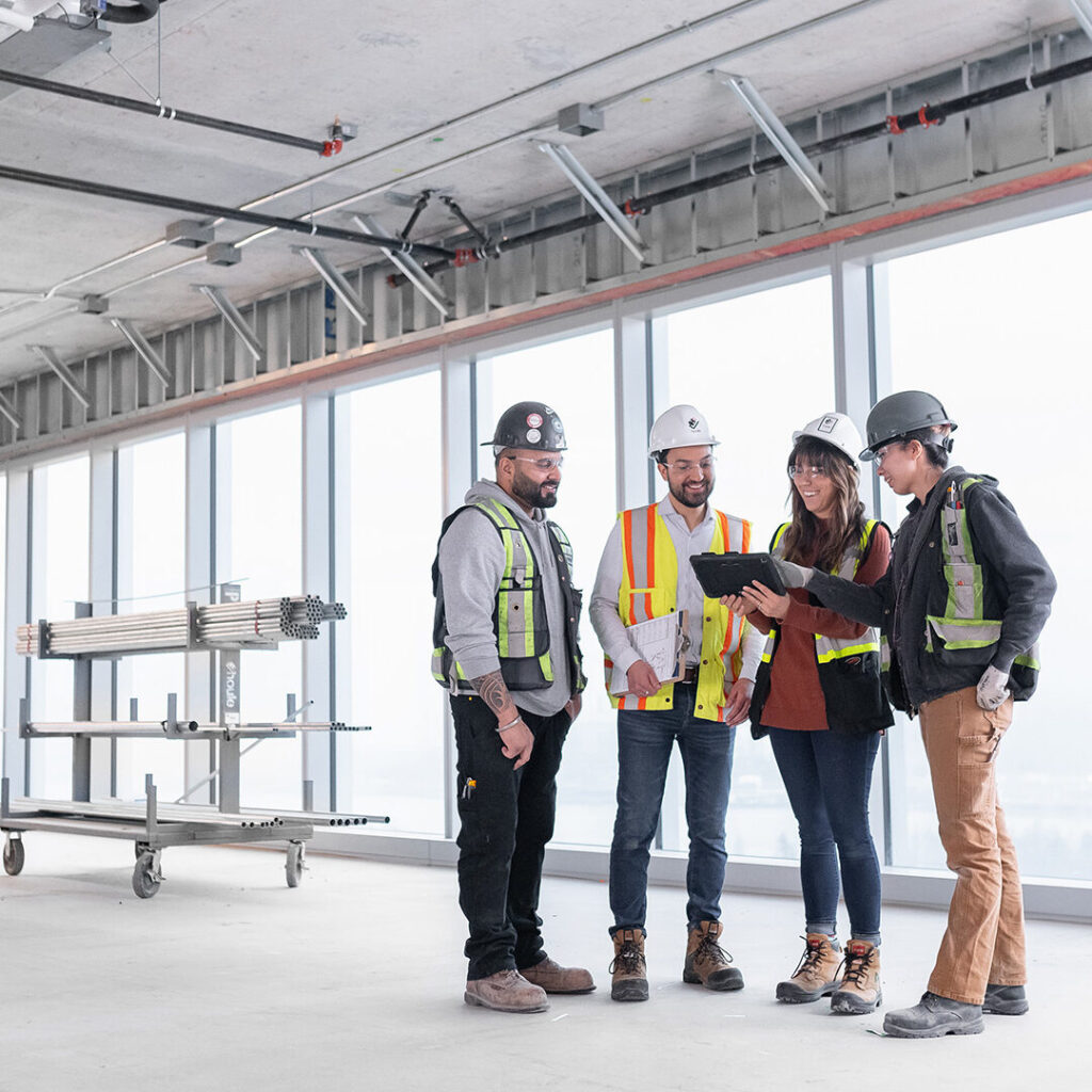 Houle Field Team Collaborating On Site