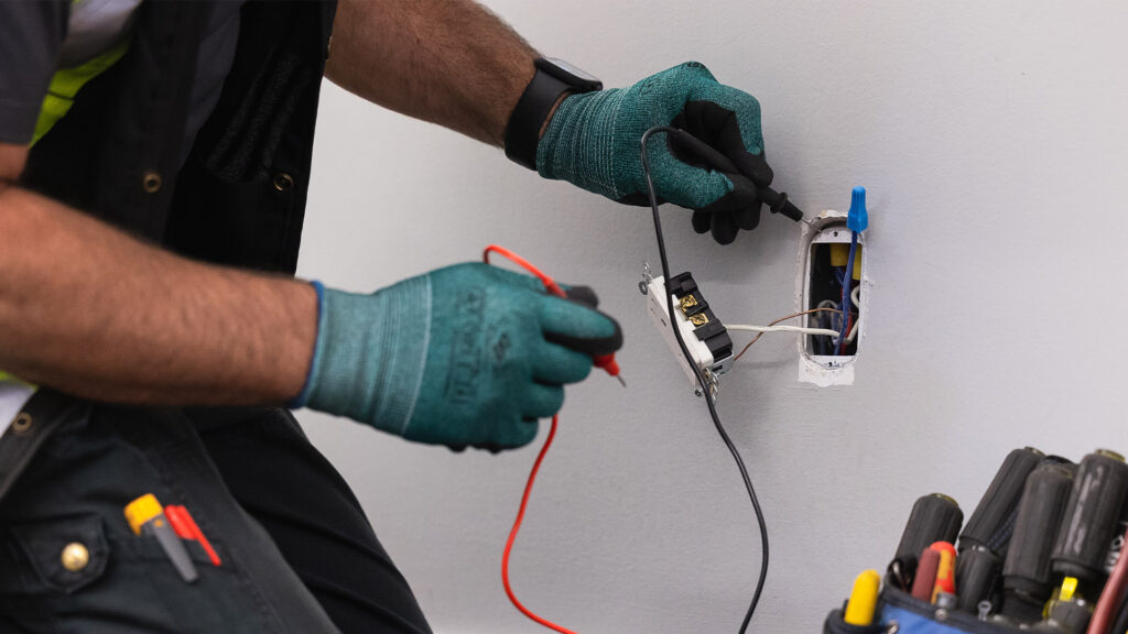 A licensed electrician working on electrical repair and upgrade