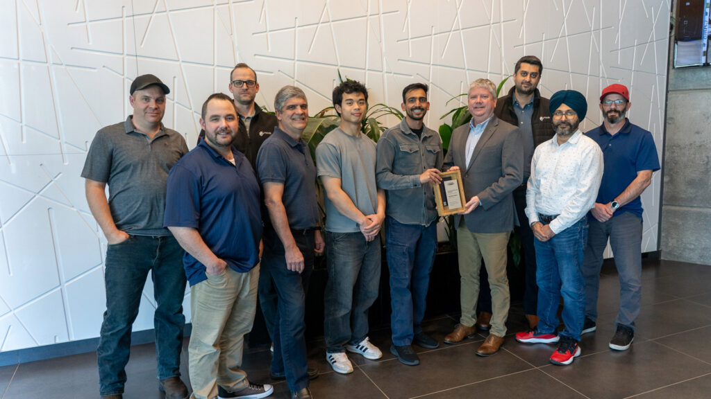Houle Controls Team Accepting Reliable Controls Award.