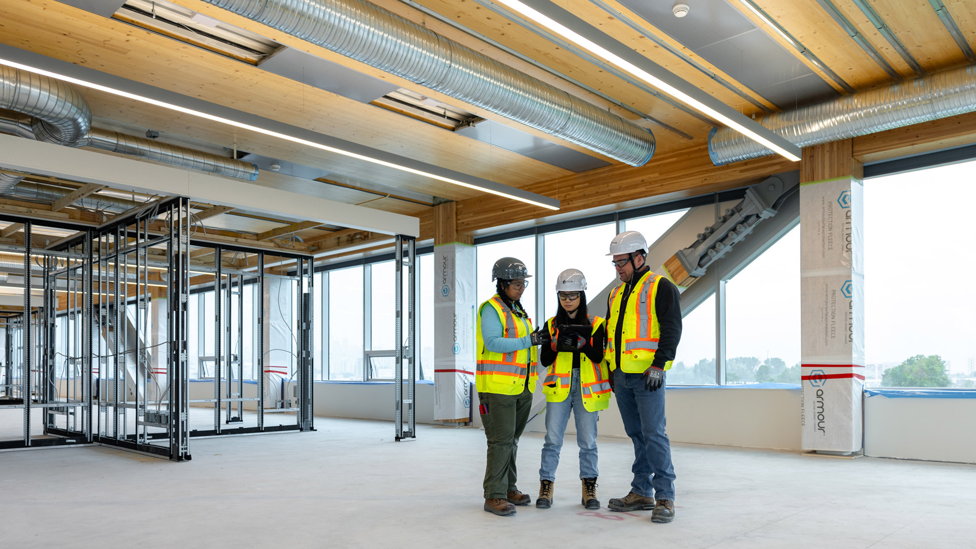 Houle team collaborating on site